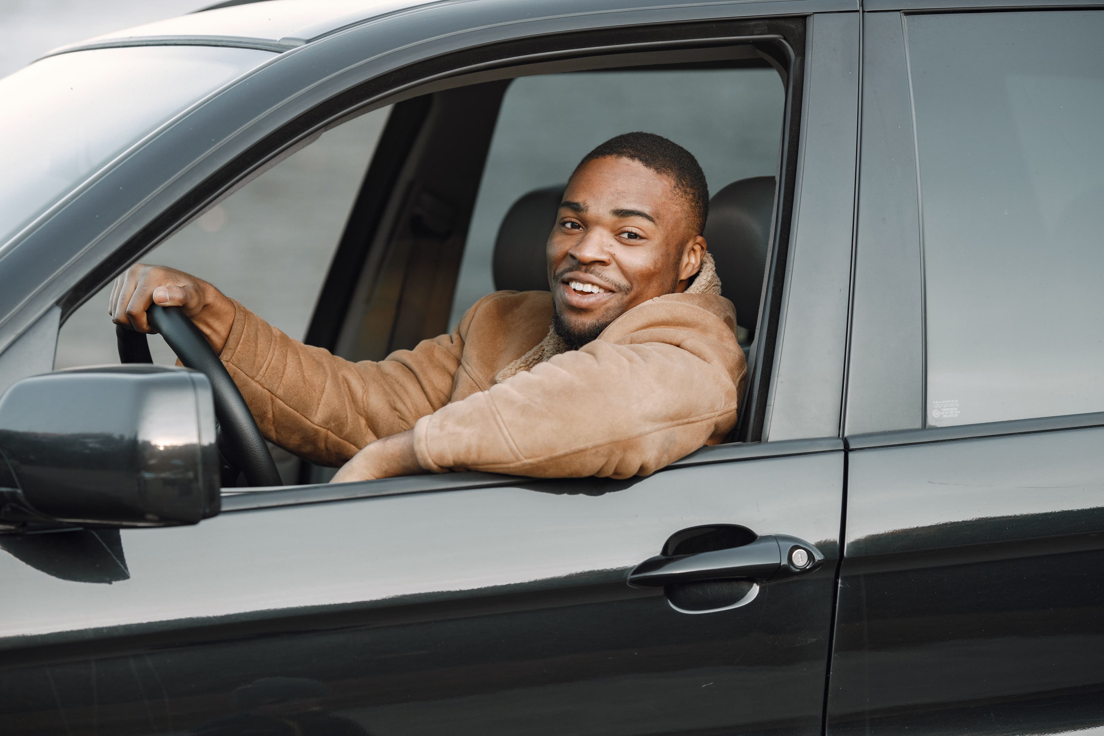 Driver smiling in a car